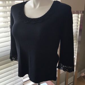 Black flat knit top with crochet detail